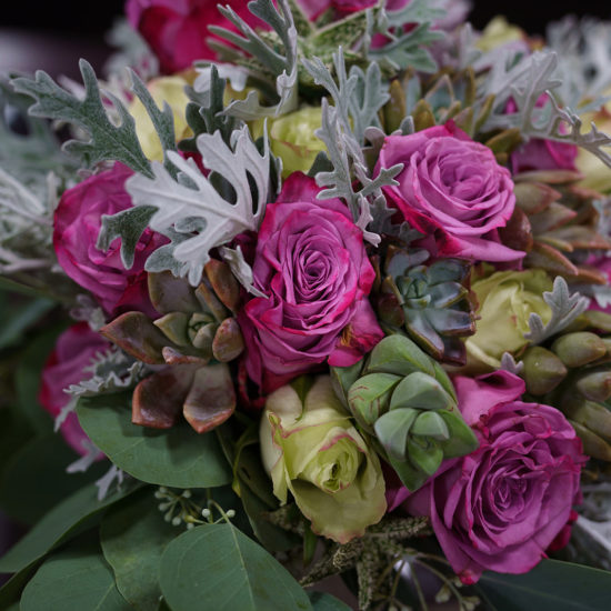 A beautiful bouquet of flowers in pink and green.