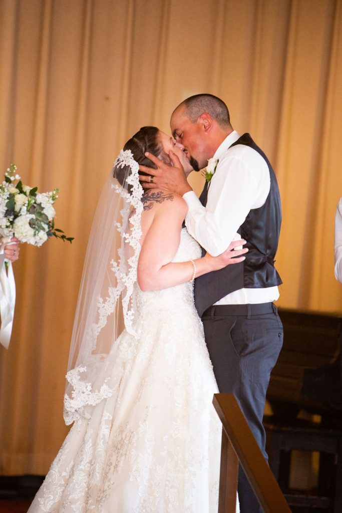 The bride and groom sharing their first kiss!